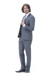 businessman straightening his tie isolated on a white background