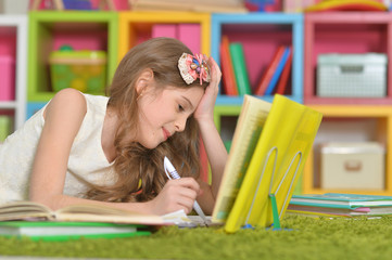 little cute girl doing homework 