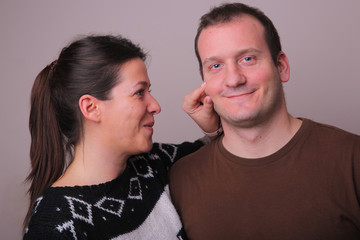 Young couple in love. Smiles on the faces.