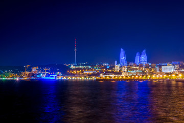 Fototapeta na wymiar Baku downtown and flame towers at night