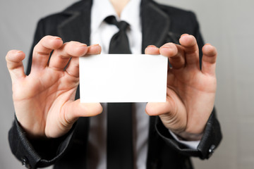 Businesswoman holding a business card. Mock up. Copy space.