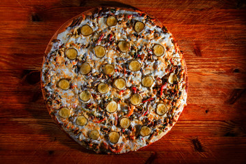 pizza on wooden background