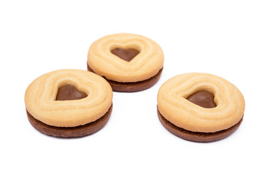 Chocolate heart in round biscuit isolated on white background