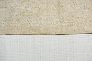 a piece of white primed canvas and non-primed canvas