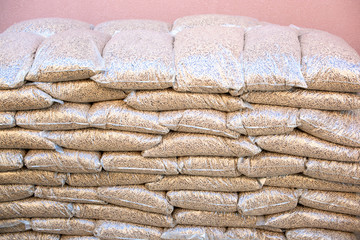 Pile of sacks ful with wooden pellets