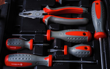 set of hand various work tools on grey background top view including different kinds of wrenches, pliers, clamps, calipers and other