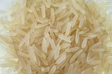 Grains of jasmine rice close-up. One of the varieties of rice. Selective focus.