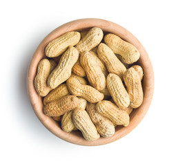 The unpeeled peanuts isolated on white background.