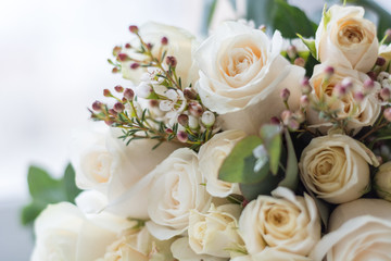 Obraz premium Tender beautiful wedding bouquet closeup, peach color roses and decoration, selective focus