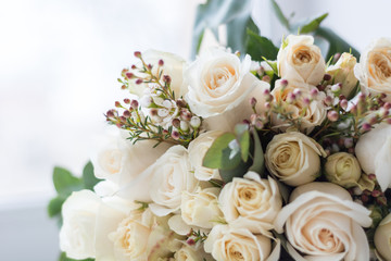 Tender beautiful wedding bouquet closeup,  peach color roses and decoration, selective focus