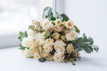 Tender beautiful wedding bouquet closeup,  peach color roses and decoration, selective focus