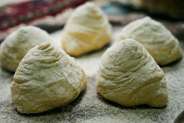 Novruz tray with Azerbaijan traditional pastry cookie Badambura on wooden rustic table background. Dessert for the Azerbaijani national holiday Novruz Bayram