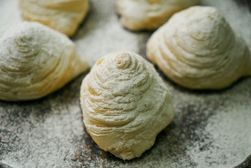 Novruz tray with Azerbaijan traditional pastry cookie Badambura on wooden rustic table background. Dessert for the Azerbaijani national holiday Novruz Bayram