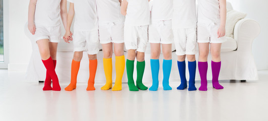 Kids with colorful socks. Children footwear.