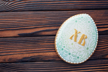 Glazed Easter gingerbread on a dark wooden table