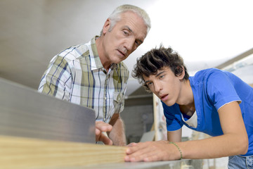 Senior carpenter training apprentice