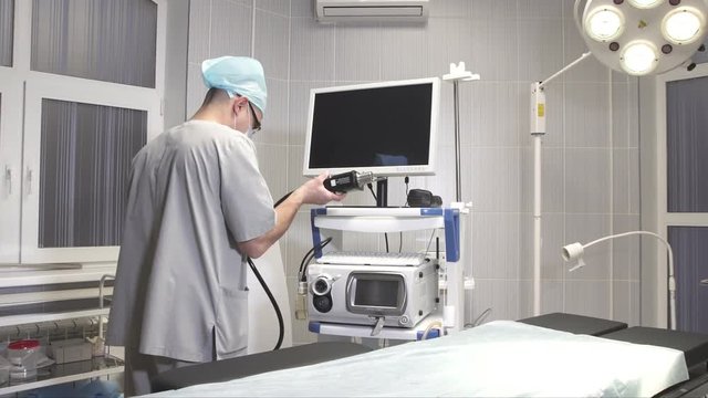 a young doctor prepares medical equipment for work