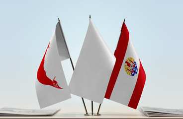 Flags of Easter Island and French Polynesia with a white flag in the middle