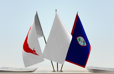 Flags of Easter Island and Guam with a white flag in the middle