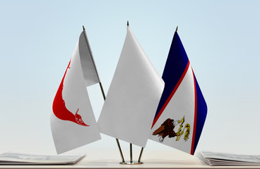 Flags of Easter Island and American Samoa with a white flag in the middle