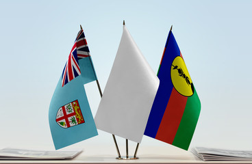 Flags of Fiji and New Caledonia with a white flag in the middle