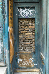 Naklejka premium Belgrade, Serbia March 12, 2018: Bricked Up Doorway in the center of Belgrade in Svetogorska Street.