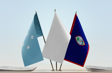 Flags of Federated States of Micronesia and Guam with a white flag in the middle