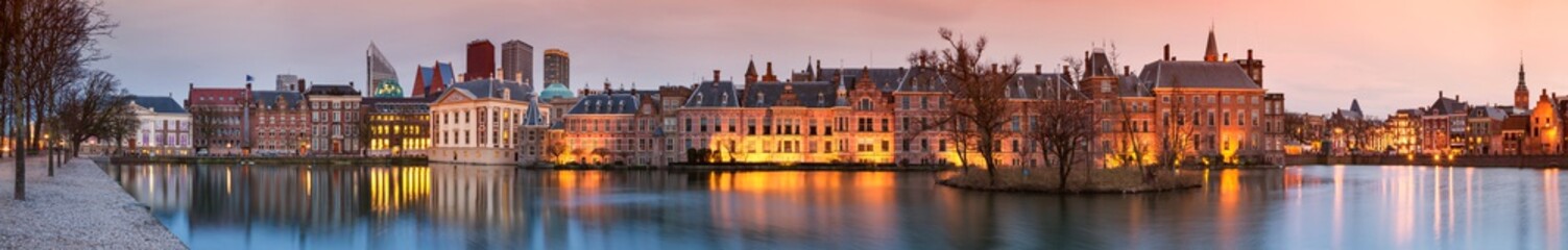 City Landscape, sunset panorama - view on pond Hofvijver and complex of buildings Binnenhof in from the city centre of The Hague, The Netherlands. - obrazy, fototapety, plakaty