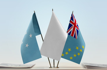 Flags of Federated States of Micronesia and Tuvalu with a white flag in the middle