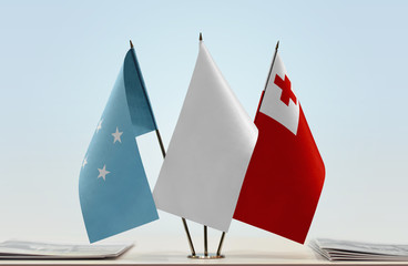 Flags of Federated States of Micronesia and Tonga with a white flag in the middle