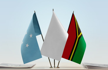 Flags of Federated States of Micronesia and Vanuatu with a white flag in the middle