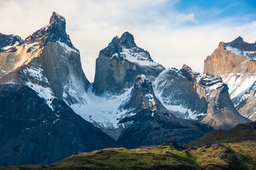 Dramatic mountains - the Cuernos del Paine - soar skyward from turquoise Grey Lake, Chile