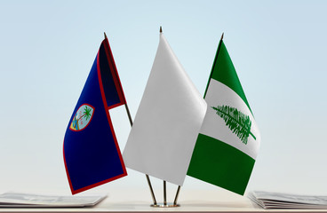 Flags of Guam and Norfolk Island with a white flag in the middle