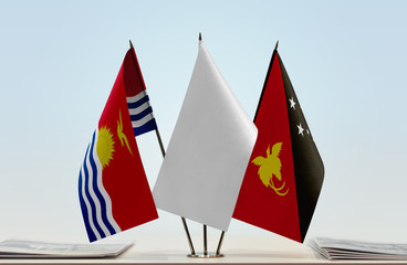 Flags of Kiribati and Papua New Guinea with a white flag in the middle