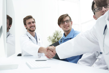 Fototapeta na wymiar handshake two medical colleagues