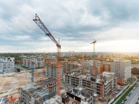 Aerial view of construction site with crane and building. Top view of big development construction and architecture.