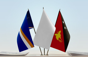 Flags of Marshall Islands and Papua New Guinea with a white flag in the middle