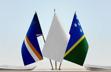 Flags of Marshall Islands and Solomon Islands with a white flag in the middle