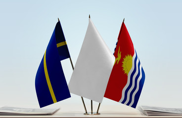 Flags of Nauru and Kiribati with a white flag in the middle