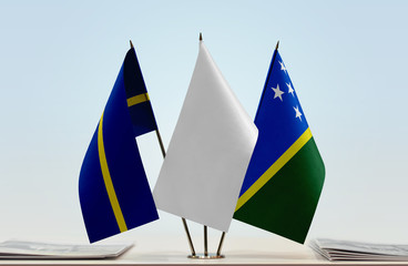 Flags of Nauru and Solomon Islands with a white flag in the middle