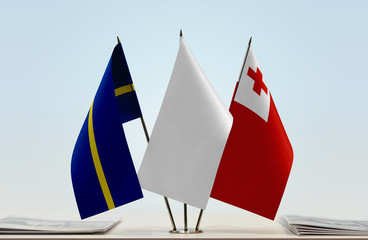 Flags of Nauru and Tonga with a white flag in the middle