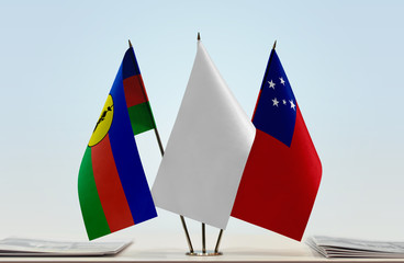 Flags of New Caledonia and Samoa with a white flag in the middle