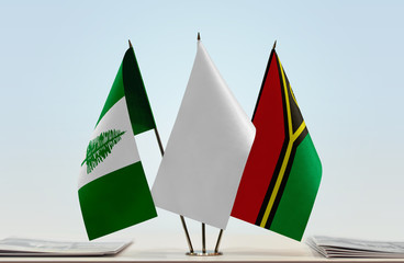 Flags of Norfolk Island and Vanuatu with a white flag in the middle