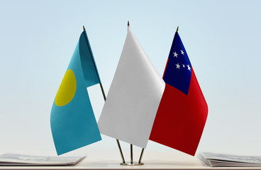 Flags of Palau and Samoa with a white flag in the middle