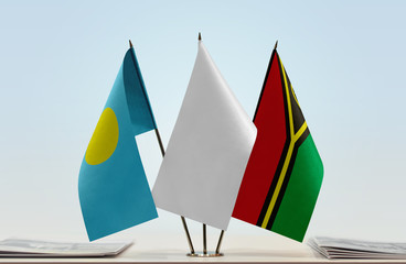 Flags of Palau and Vanuatu with a white flag in the middle