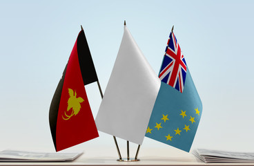 Flags of Papua New Guinea and Tuvalu with a white flag in the middle