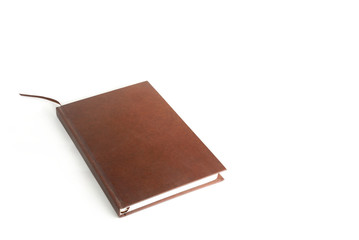 Brown  notebook on white background.
