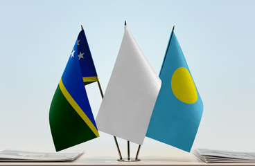 Flags of Solomon Islands and Palau with a white flag in the middle