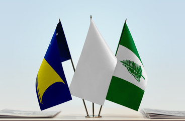 Flags of American Samoa and Norfolk Island with a white flag in the middle