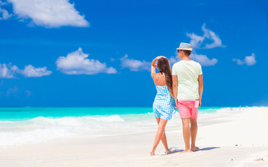 attractive couple enjoying sunny day at Cayo Largo beach, Cuba